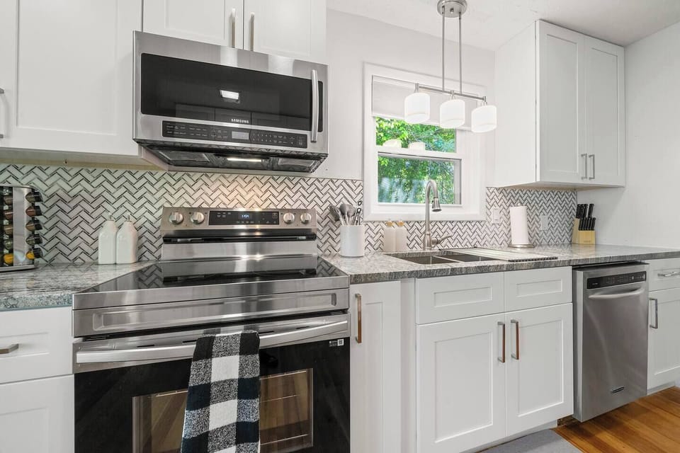 Cottage A- All brand new appliances accompanied by white cabinets and drawers.