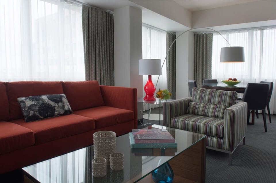 Spacious living area with a plush  sofa and modern decor, blending comfort and style.