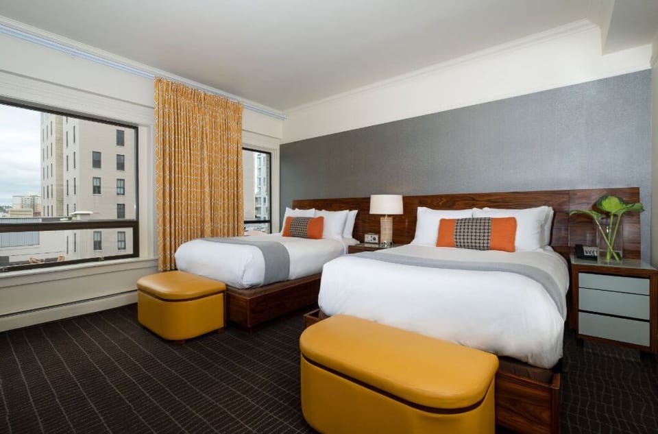Bright and contemporary Double Bed room designed for comfort, complete with stylish furnishings and vibrant accents.