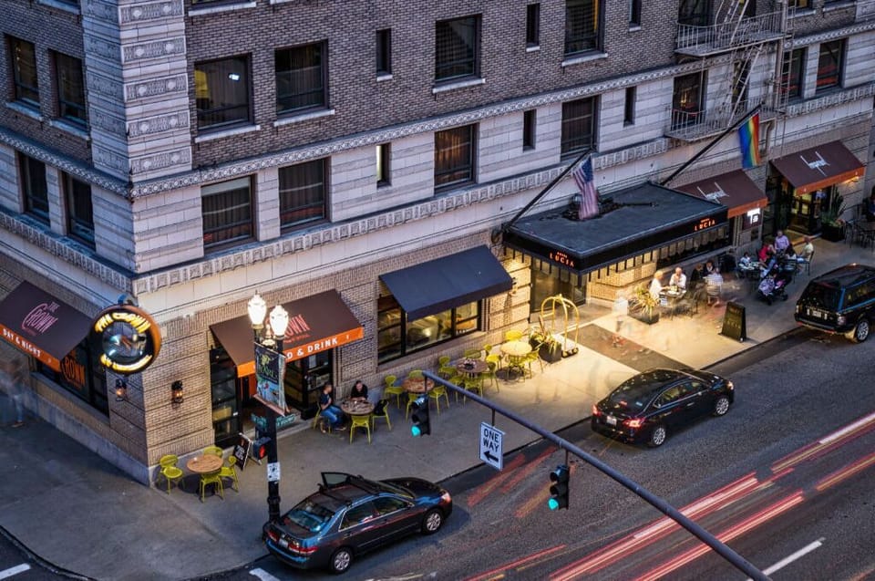 Aerial view of Hotel Lucia's corner location, highlighting the vibrant urban intersection.