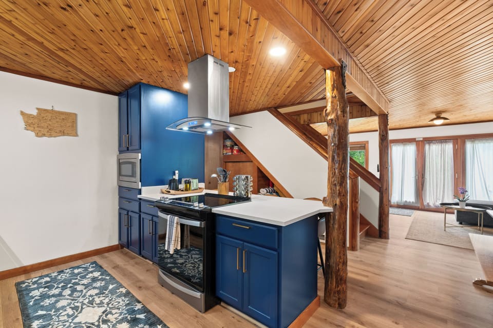 Designer touches in this chef’s kitchen with island and fully stocked cabinets.