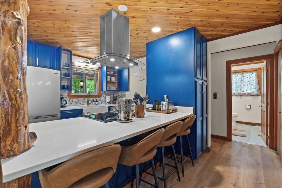 Chef’s kitchen with island seating and modern appliances