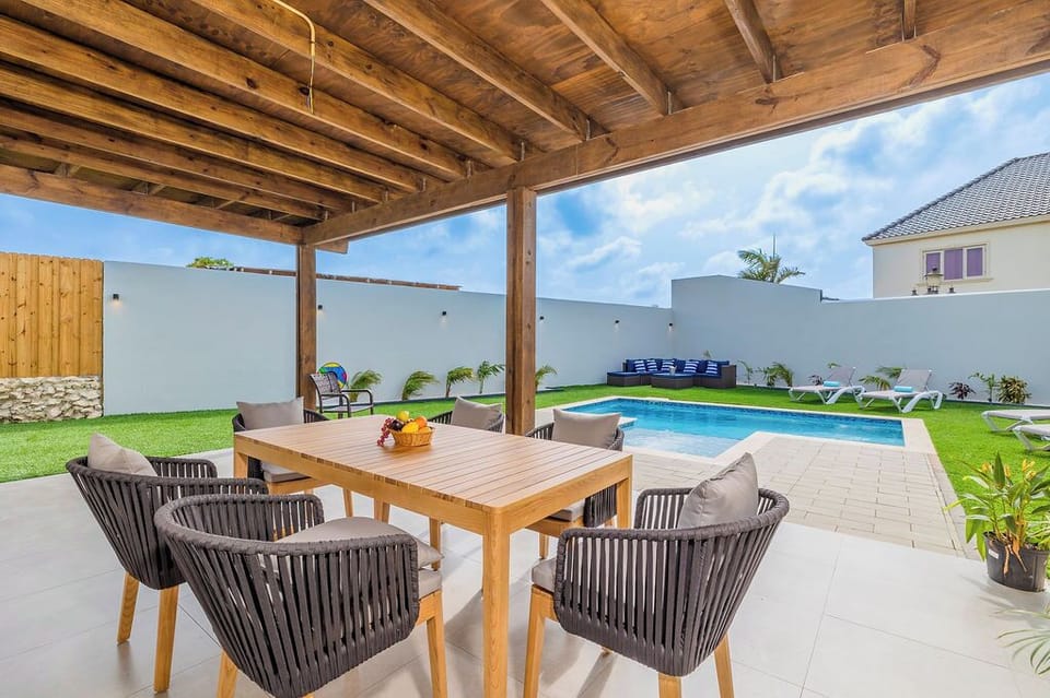 Experience the joy of outdoor living in our charming sitting area. Whether you're catching up with loved ones or simply enjoying a quiet moment alone, our outdoor space provides the perfect backdrop for relaxation and enjoyment.