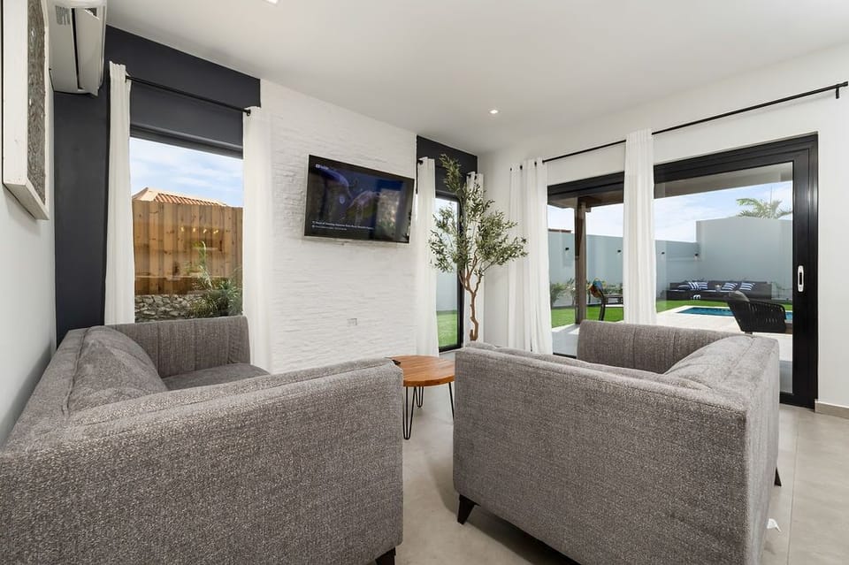 Movie night, anyone? Our living area is the ultimate retreat for cozy evenings in, complete with a comfortable sofa and TV for hours of entertainment.