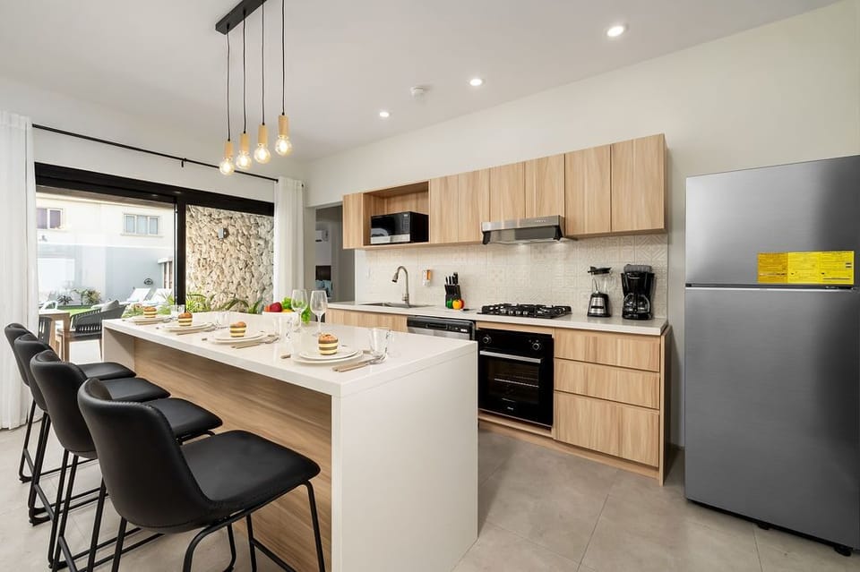 Gather 'round the counter! Our kitchen invites you to pull up a seat and enjoy casual dining with a side of conversation and laughter.