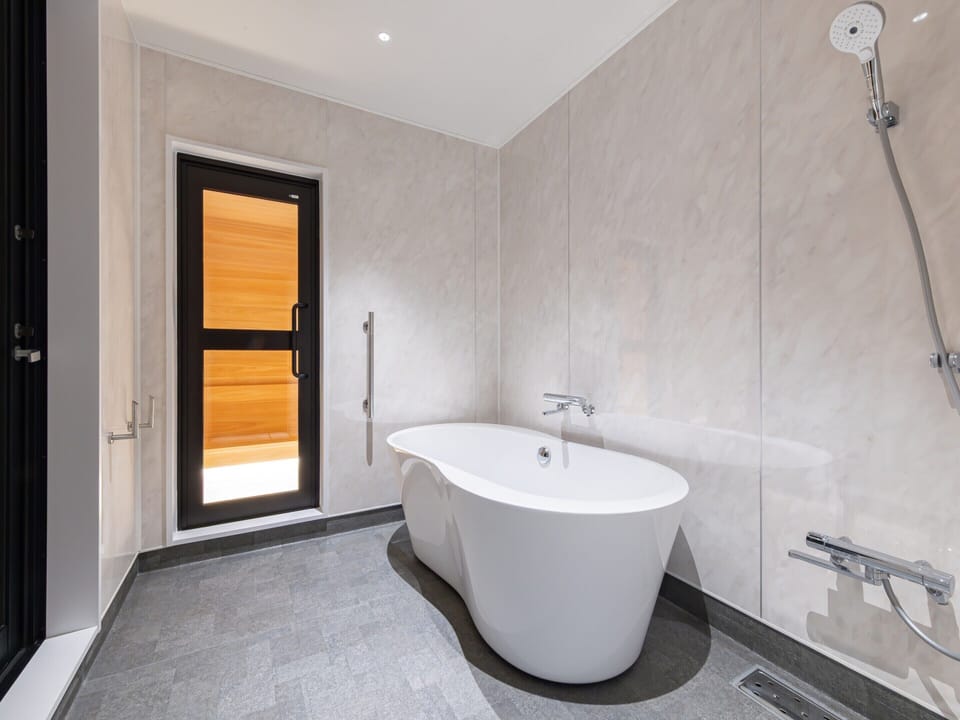 Separate tub and shower, free toiletries, hair dryer, slippers