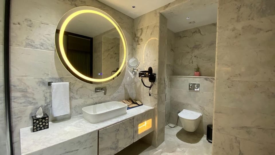 Shower, rainfall showerhead, designer toiletries, hair dryer
