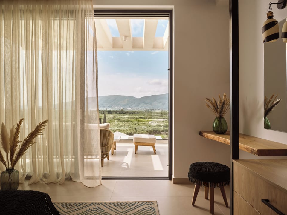 Bedroom setting featuring direct access to a spacious balcony.