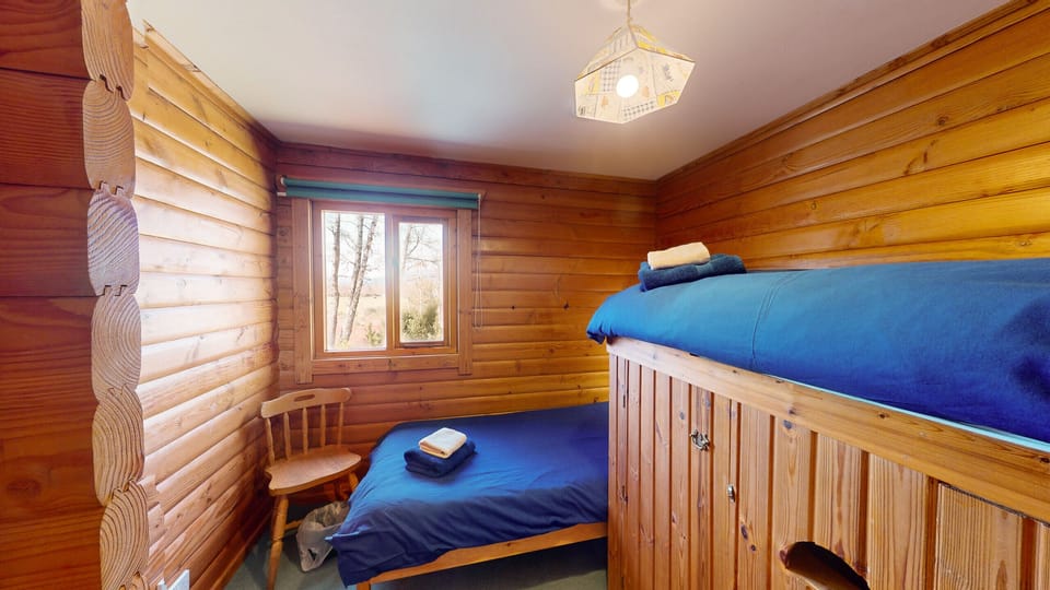 Two single beds in the bunk room