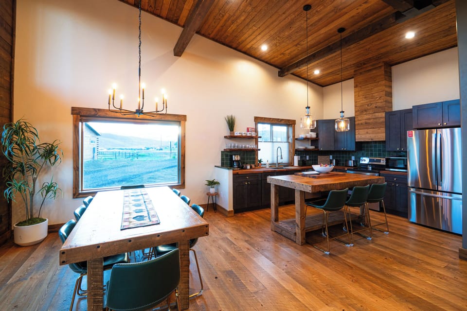 Cabin dining room (with mountain views) and full kitchen.