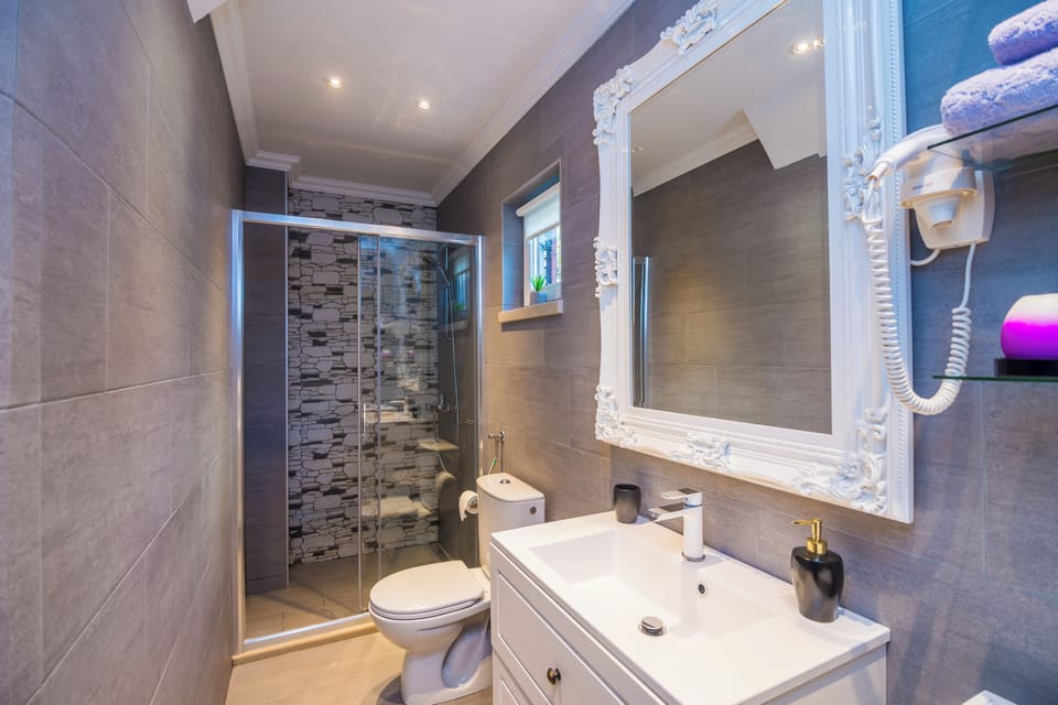 Villa (Three-Bedroom Villa with Terrace and ) | Bathroom | Shower, towels
