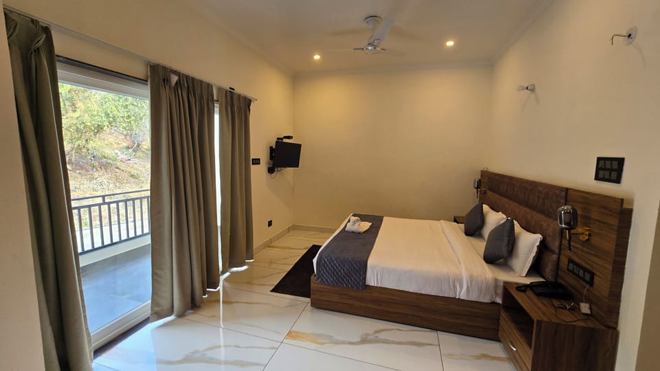Deluxe Room, Balcony, Hill View | Desk, laptop workspace, free WiFi