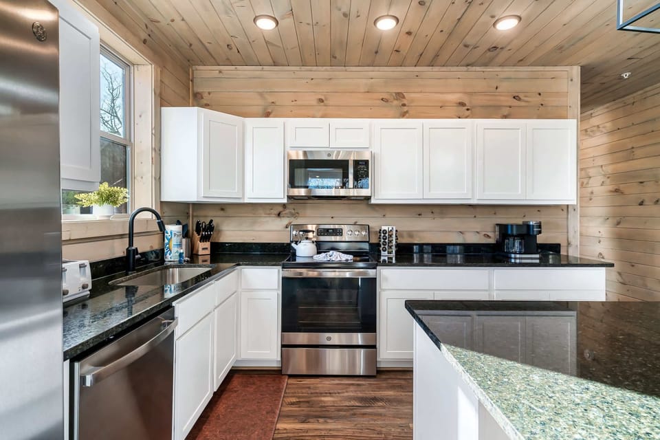Cook up memories in this stylish, modern kitchen with stunning granite countertops!