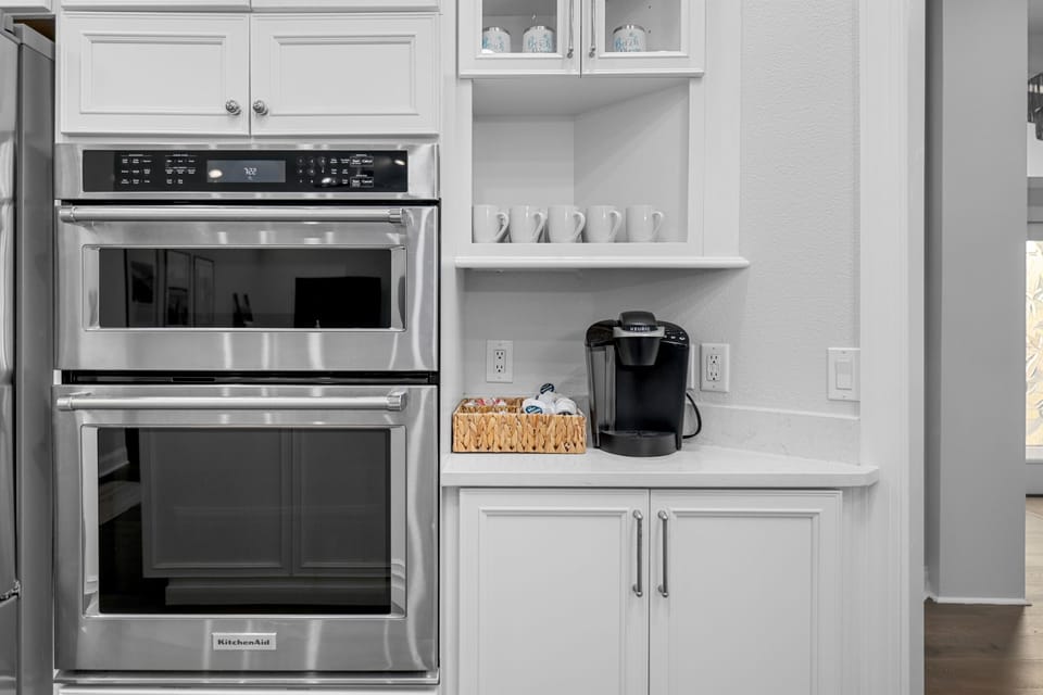 Double ovens and coffee station, fully stocked for everything from morning coffee to family dinners