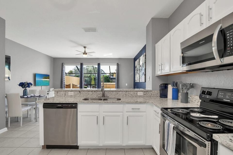 Outstanding view to the plunge pool from kitchen and living room. Great open floor plan for guests to relax while the kids can play. 