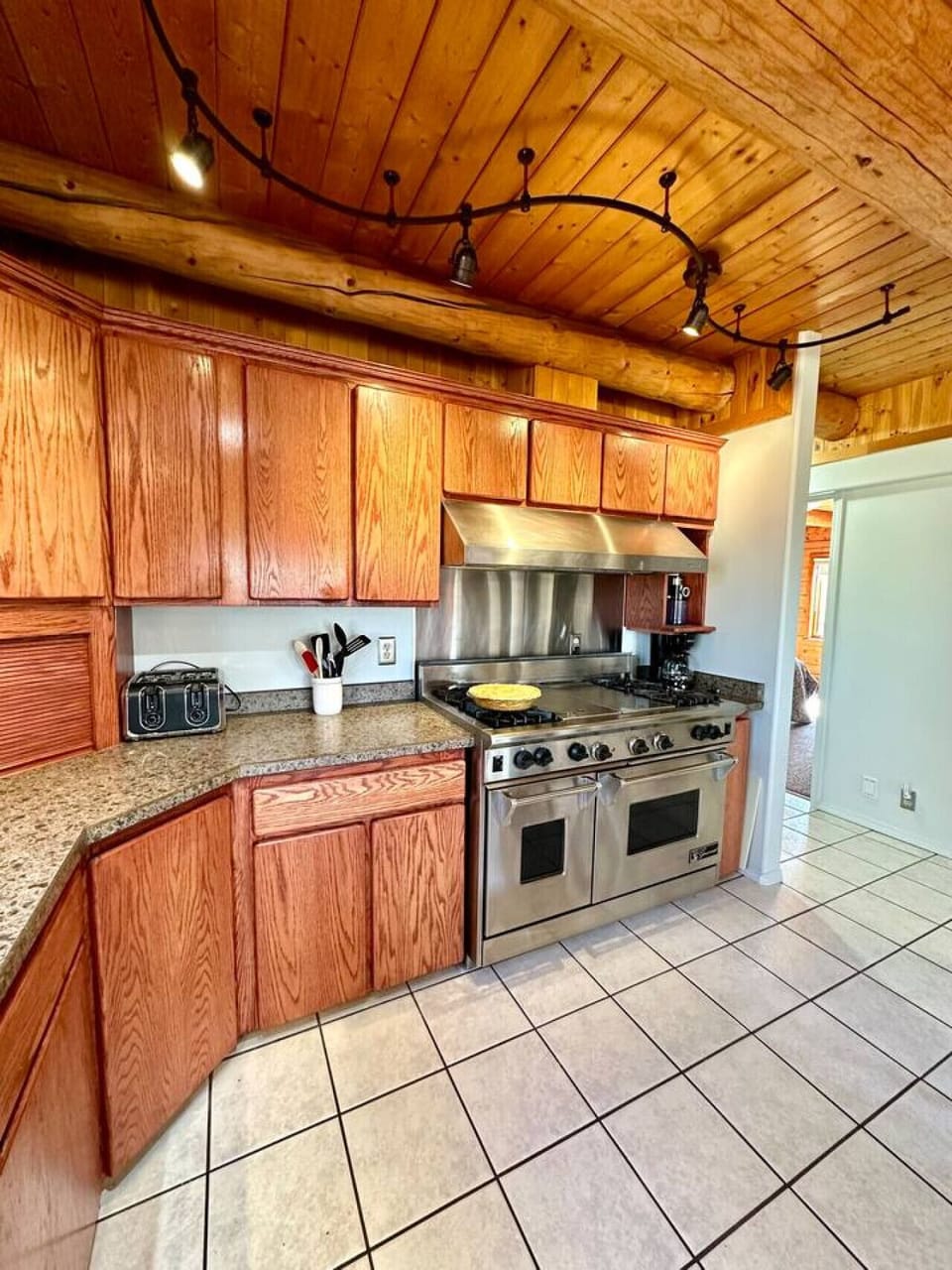 Spacious kitchen with large appliances and plenty of prep space.