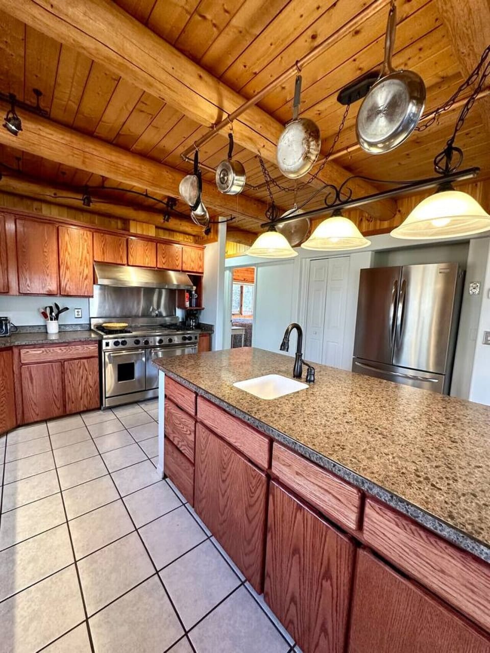 Spacious kitchen with large appliances and plenty of prep space.