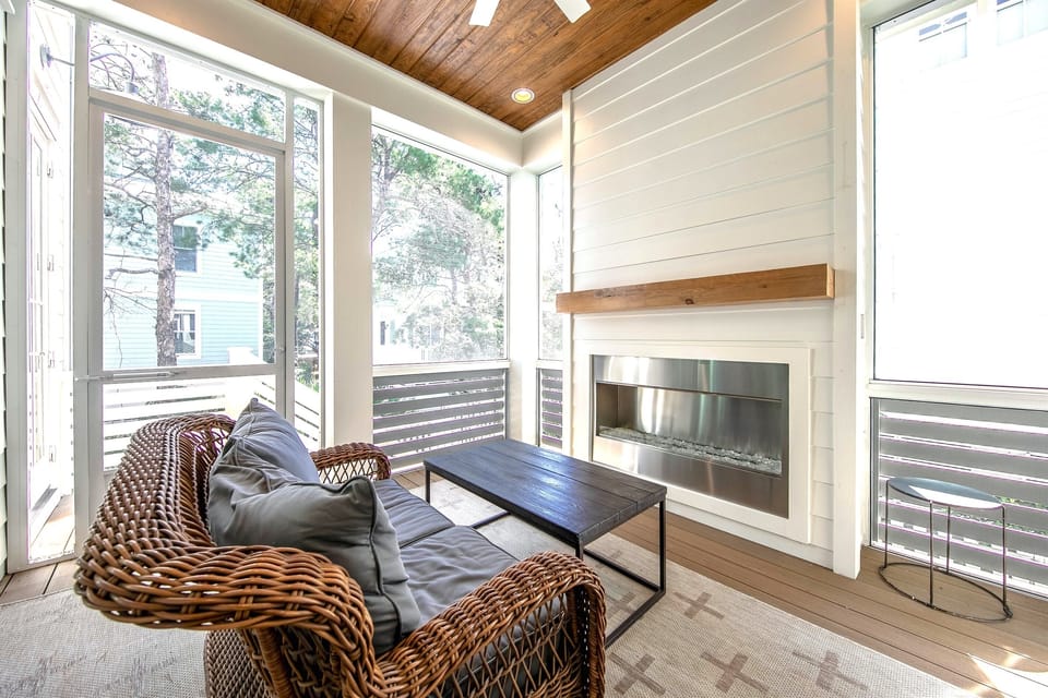 Electric fireplace and enclosed patio.
