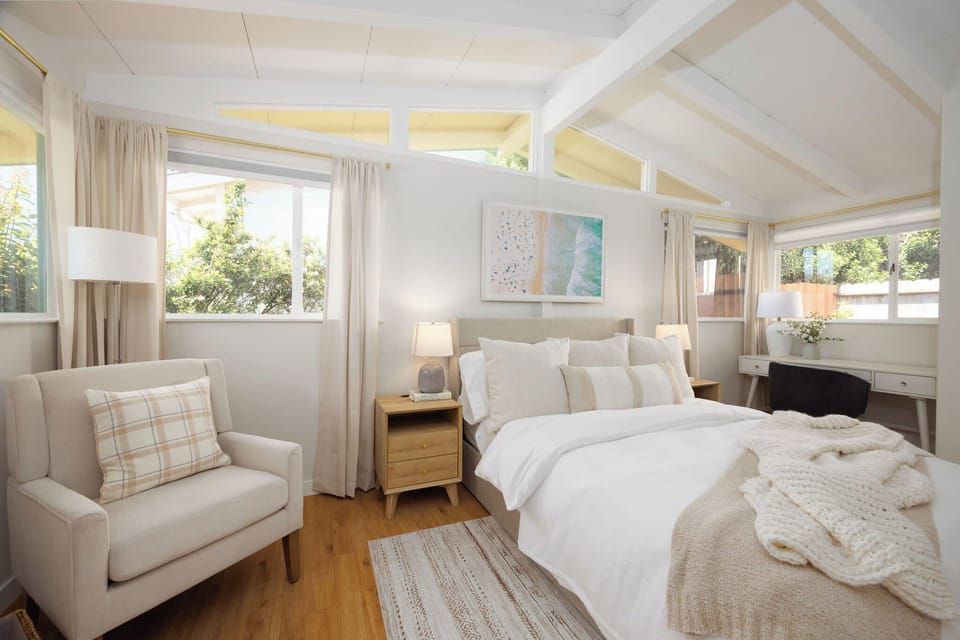Cozy ground-floor bedroom featuring a comfortable queen bed