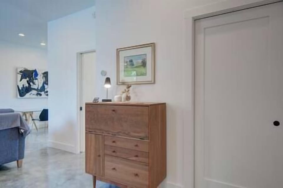 The hallway cabinet transforms into a writing desk for dedicated office space if needed. 
