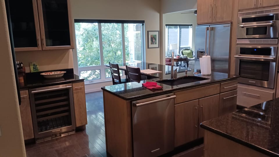 Kitchen island with seating for 4.  Built in wine cooler and walk in pantry.