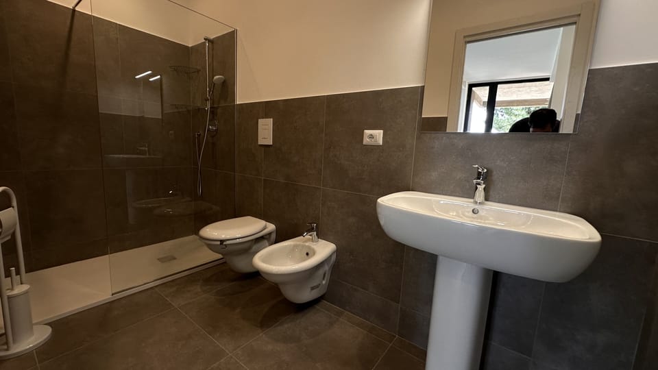 Deluxe Apartment, Garden View | Bathroom | Shower, hair dryer, towels, soap