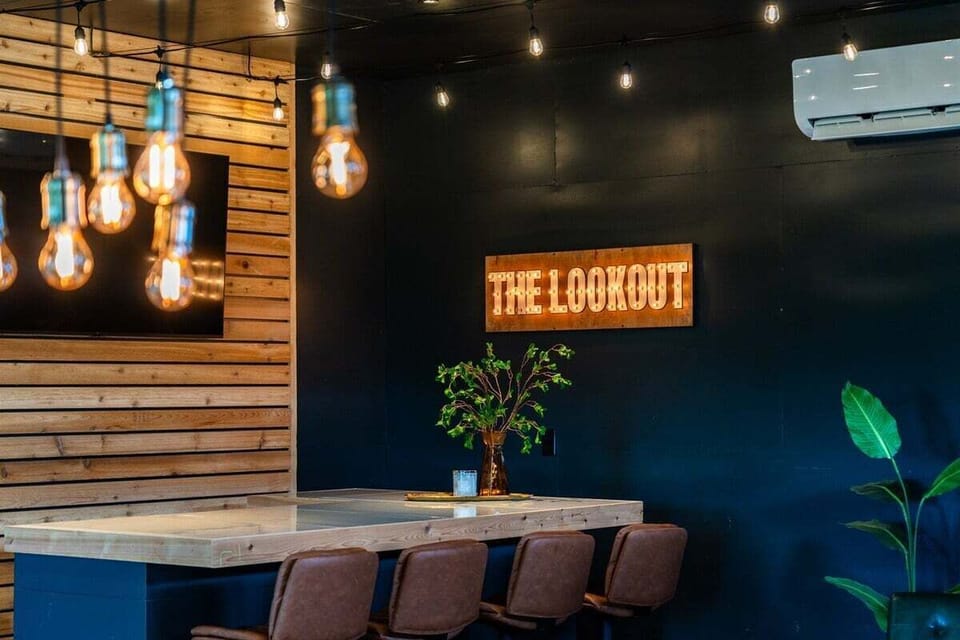 Relax in style with a drink at our chic bar, or catch up on your favorite shows in this inviting space.