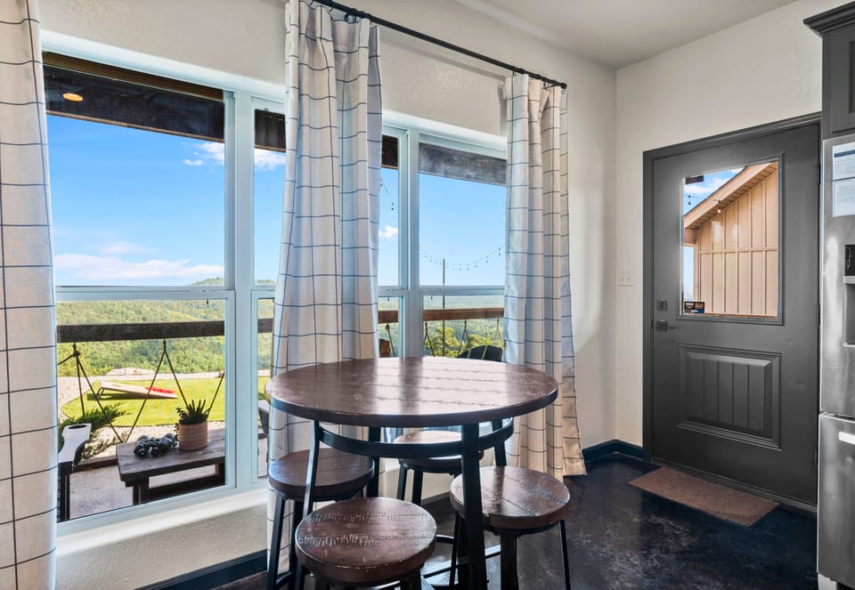 Enjoy a meal with a view in our cozy dining area, where large windows let in plenty of natural light.