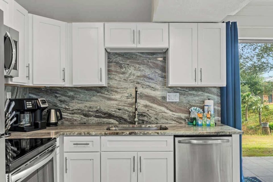 We've stocked this kitchen with full appliances, dishes, bake ware, pots & pans, silverware, utensils, crockpot, blender, and a traditional coffee maker & Keurig!
