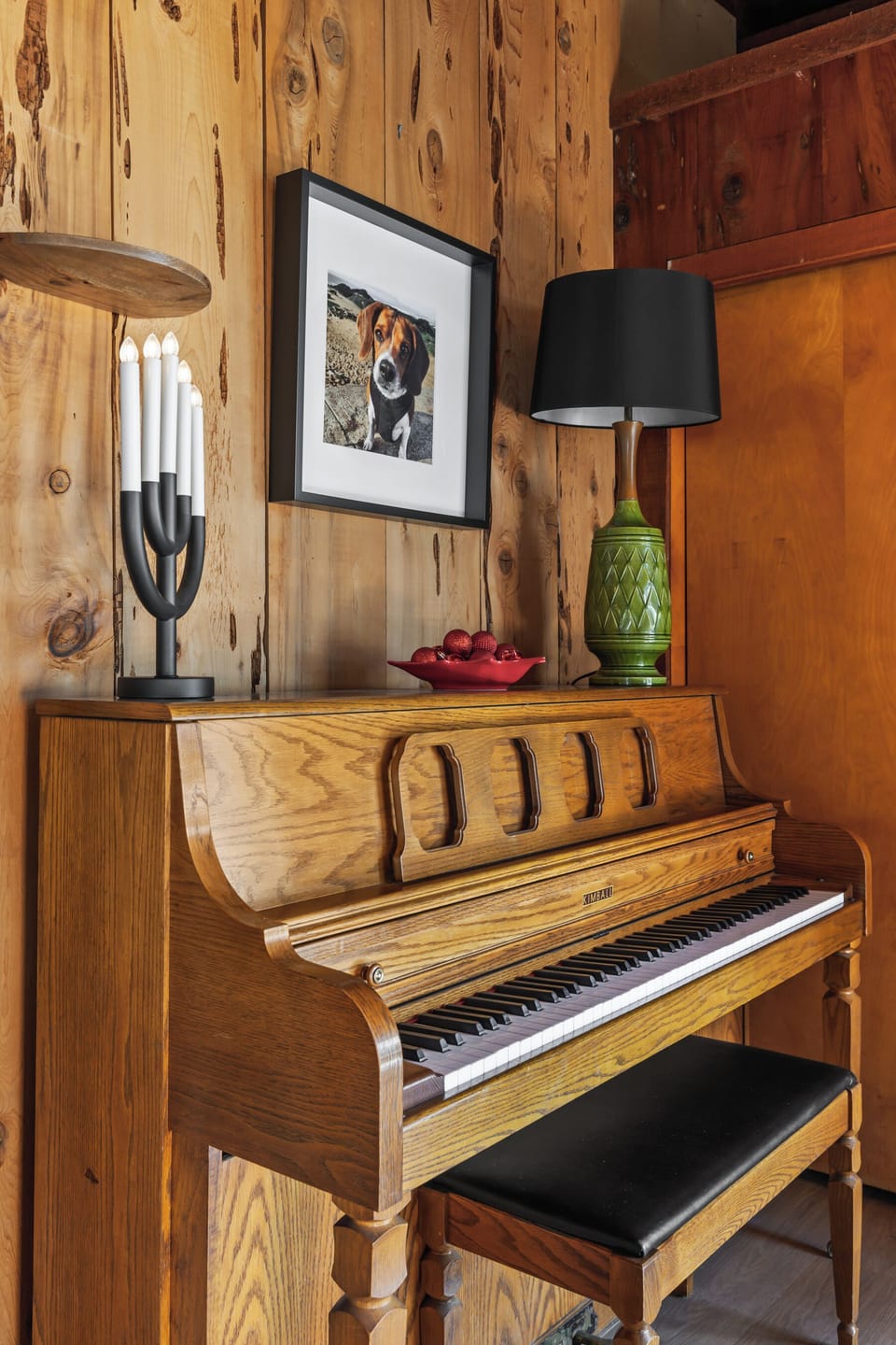 Piano music available inside the bench. Dog leash hooks by the wall. 