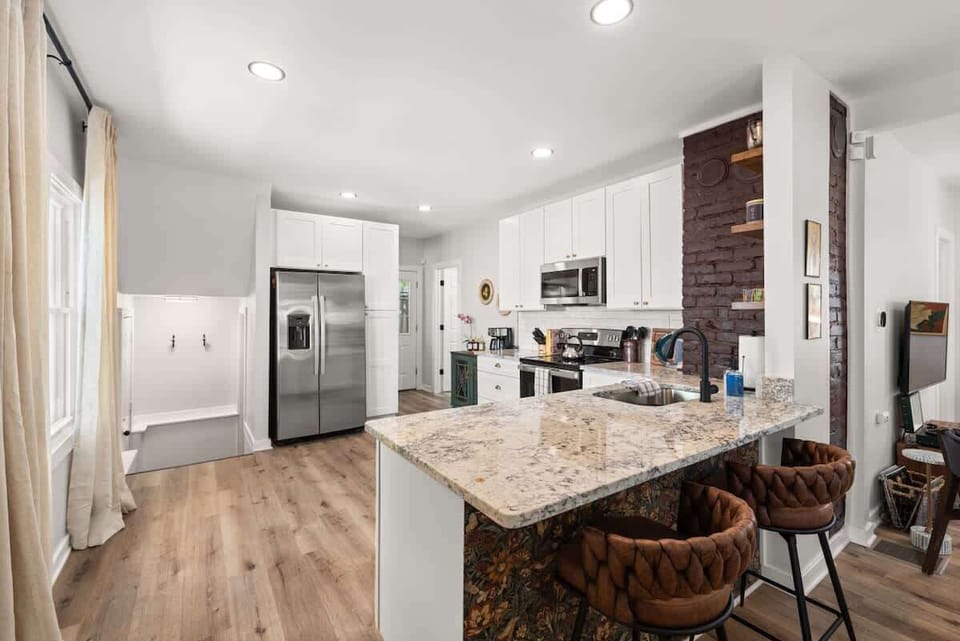 Crisp white cabinets and warm hardwood floors create the perfect blend of modern and rustic vibes in my dream kitchen!  #KitchenGoals