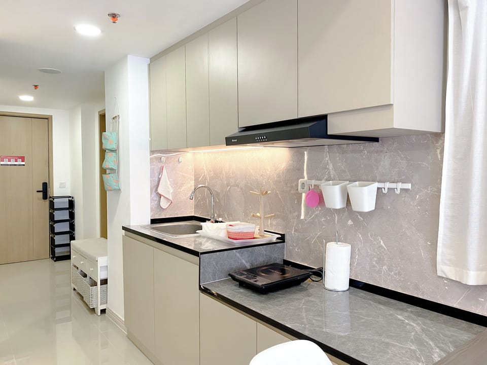 Apartment | Private kitchen | Fridge, stovetop, rice cooker, dining tables