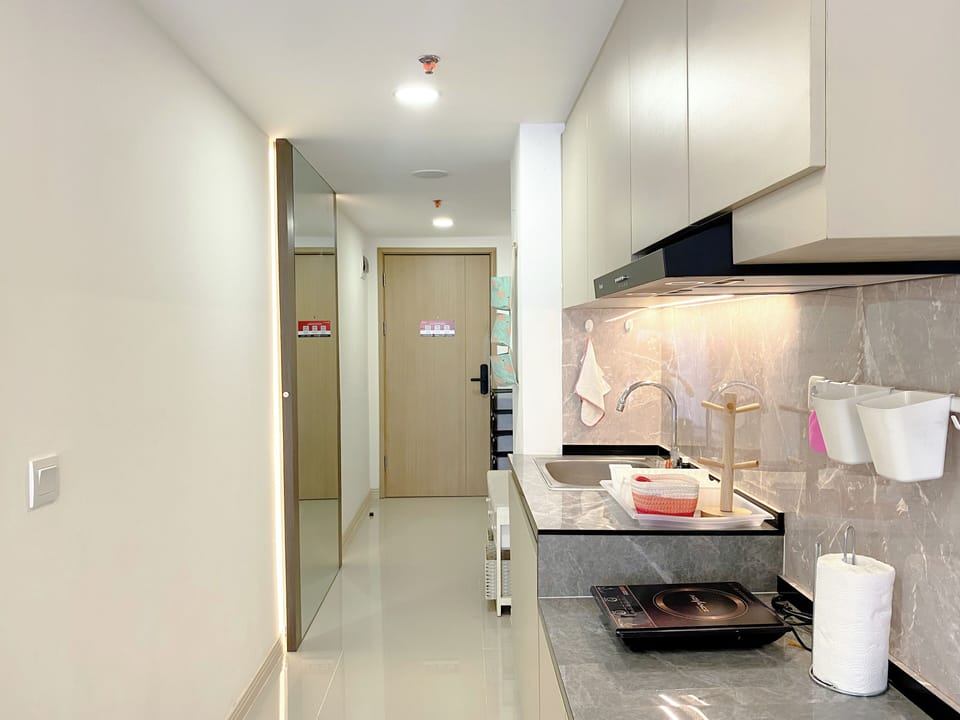 Apartment | Private kitchen | Fridge, stovetop, rice cooker, dining tables