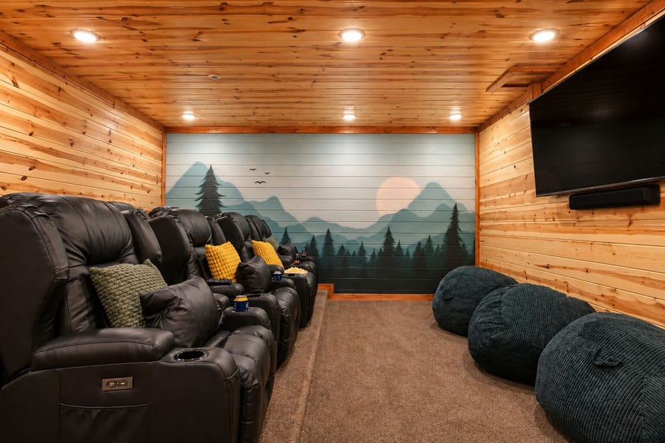 Theater room with comfy chairs for a perfect movie night.