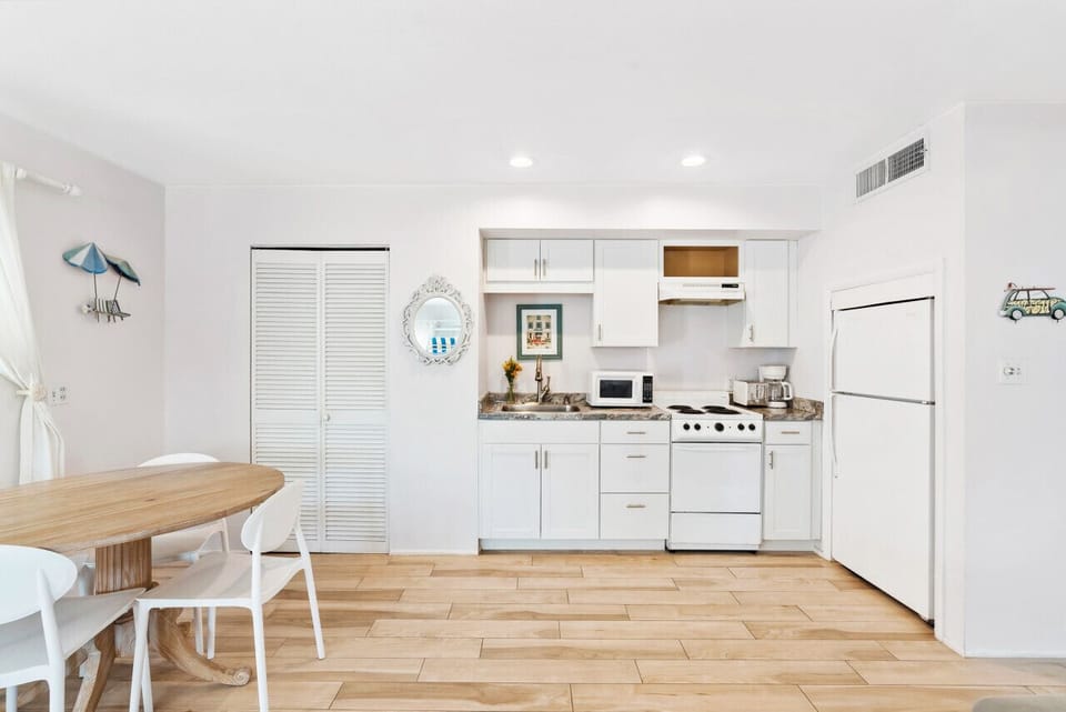 Full kitchen with oven, stove, freezer, and microwave