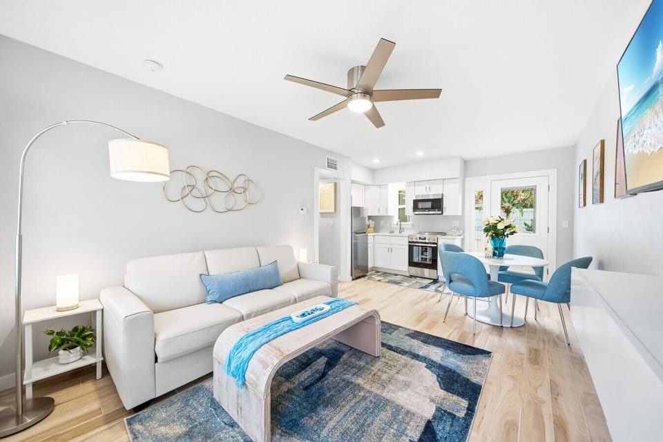 Dolphin`s living room, dining area, & full kitchen