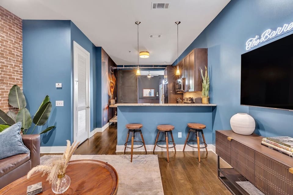 Step into a stylish and cozy living room where industrial charm meets modern sophistication.