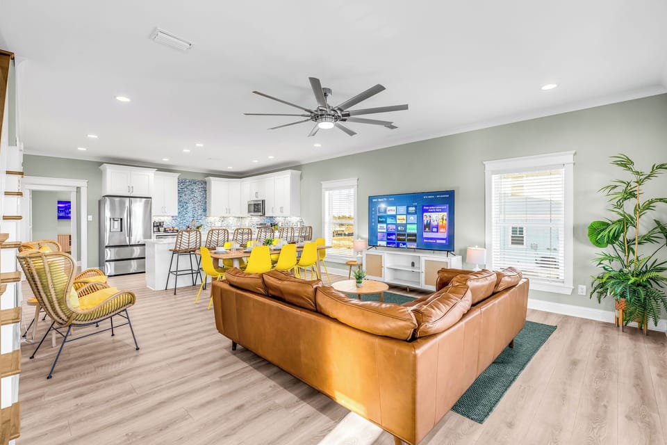 The open concept living area is optimal for entertaining, dining, and relaxing.