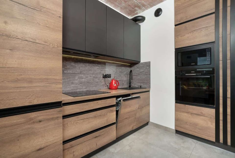 Contemporary kitchen with high-end appliances, ample storage, and sleek finishes for cooking enthusiasts.
Contemporary kitchen with high-end appliances, ample storage, and sleek finishes for cooking enthusiasts.
