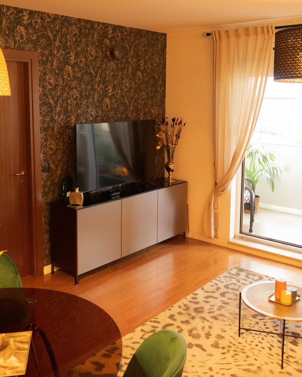 Apartment (One Bedroom Apartment with Balcony) | Living room | 32-inch flat-screen TV with digital channels