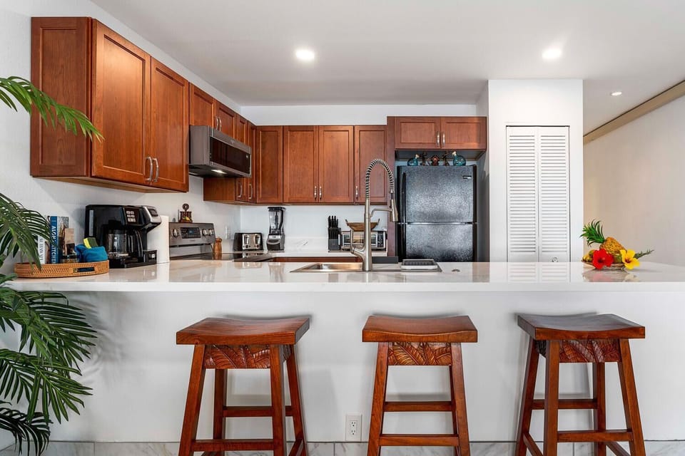 Well-appointed kitchen with breakfast bar—perfect for casual dining or entertaining.