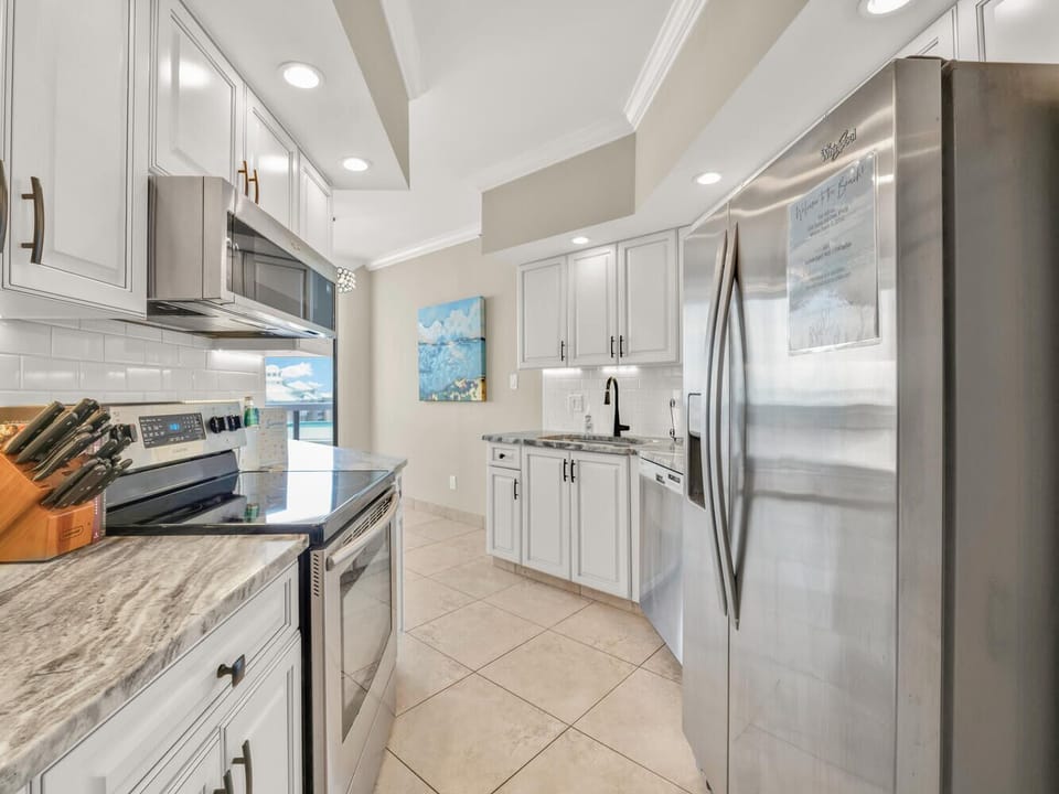 Your fully equipped kitchen awaits with granite counters, stainless steel appliances, and everything you need to create memorable meals during your stay.