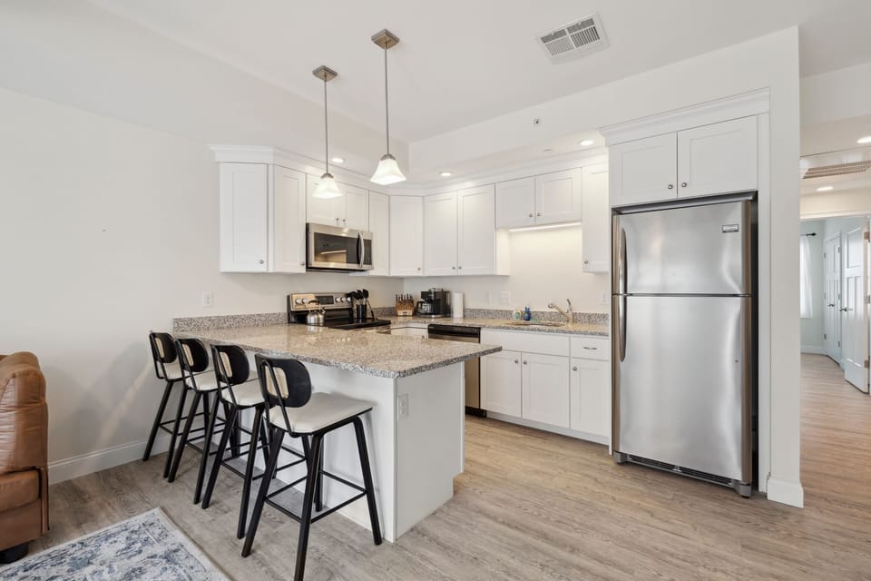 Modern kitchen with bar stool counter seating for 4