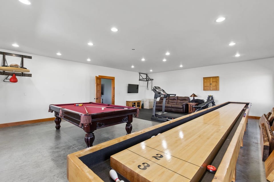Full size Shuffleboard, Pool table, Foosball and workout space. 