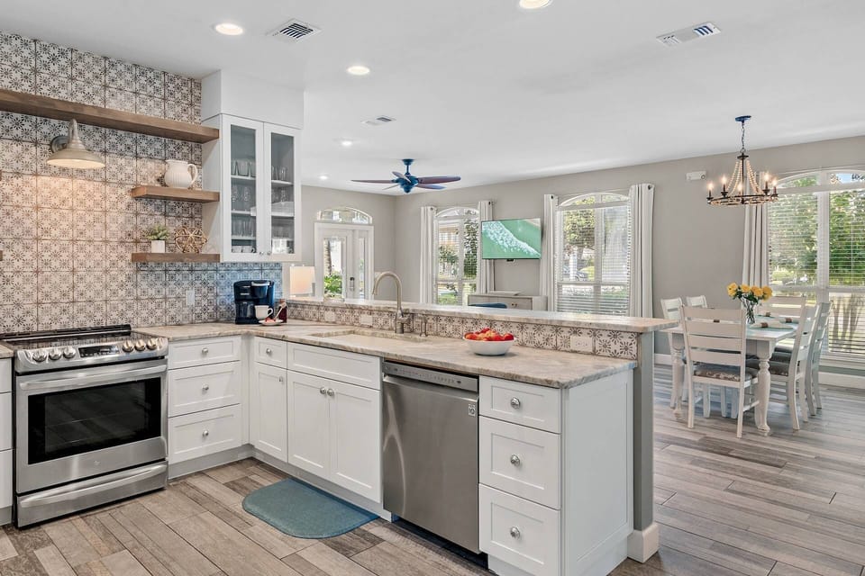 Fully Equipped Kitchen ~ Overlooking the Dining Room & Living Area with an Abundance of Natural Light