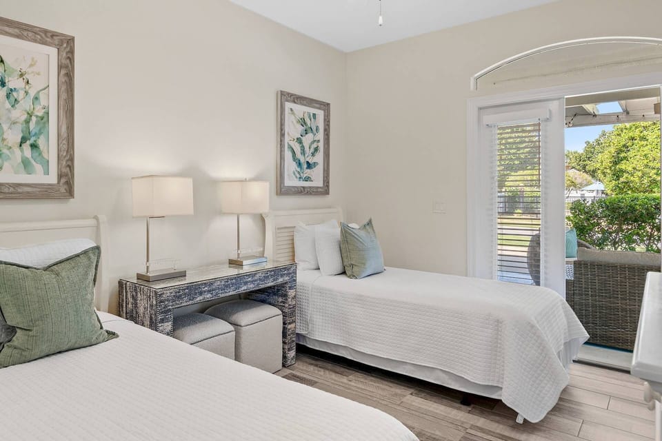 Guest Bedroom with Twin Beds, Smart TV, Ceiling Fan, Closet & French Doors open to Courtyard