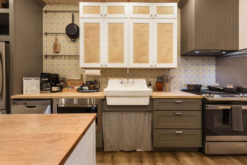 Fully stocked gourmet kitchen with ample prep space and storage