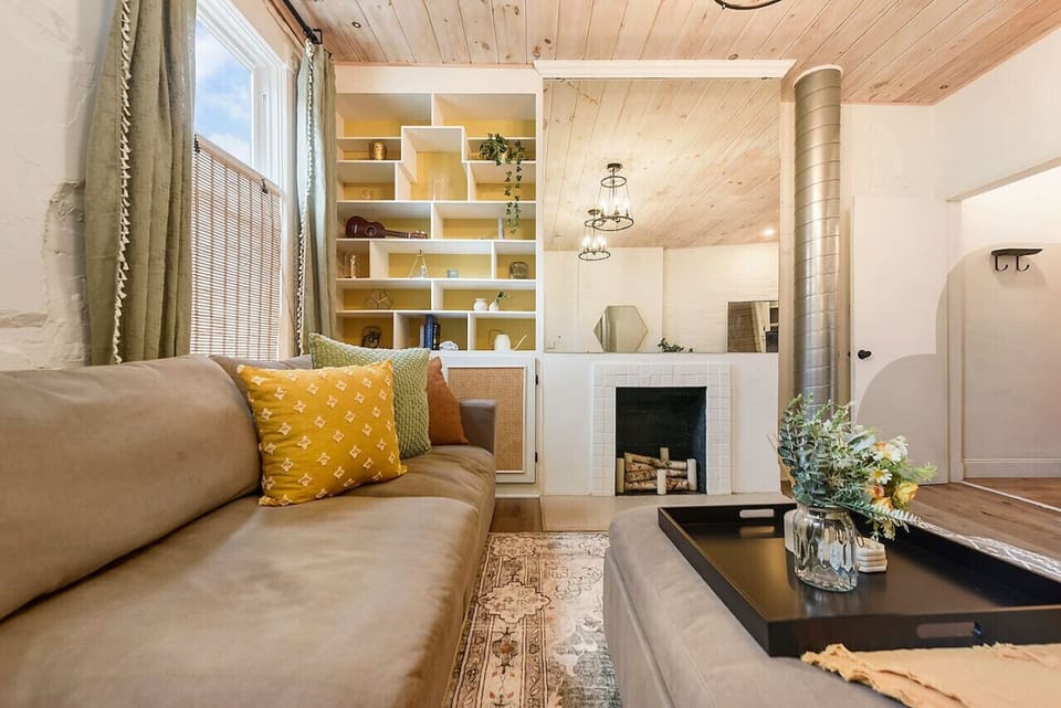 Living room with stylish seating and warm, inviting details