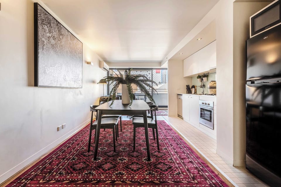 DINING AREA: Designed for connection, this inviting dining area offers ample space for four to share delicious meals and great company.