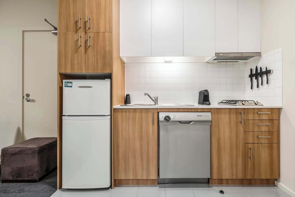 KITCHENETTE: Equipped for easy dining with essentials to reheat, prepare, and enjoy simple meals at home